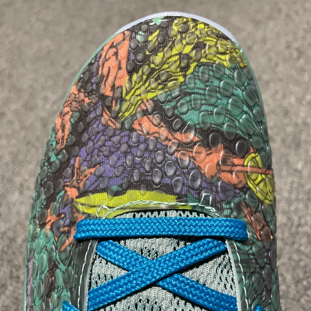 Nike Zoom Kobe 6 toe with green, purple, and orange reptile-textured upper and blue laces
