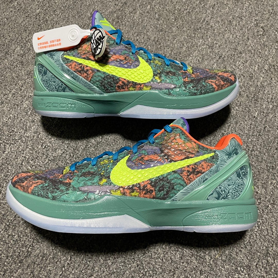 Nike Zoom Kobe 6 sneakers with green sole, blue laces, and multicolor patterned upper