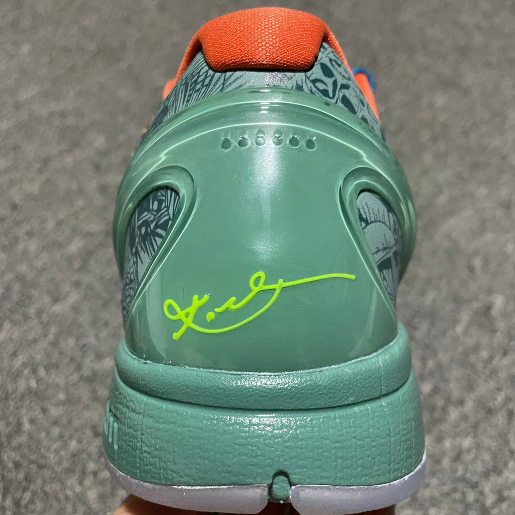 Nike Zoom Kobe 6 heel with green back panel, neon-yellow signature, and orange collar