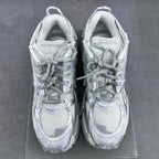 Balenciaga unisex sneakers front view with lace-up vamps and rounded toe.
