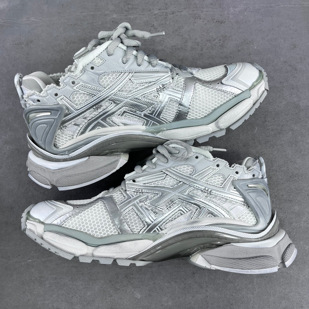 Balenciaga unisex sneakers pair in light silver-gray with lace-up and molded sole.