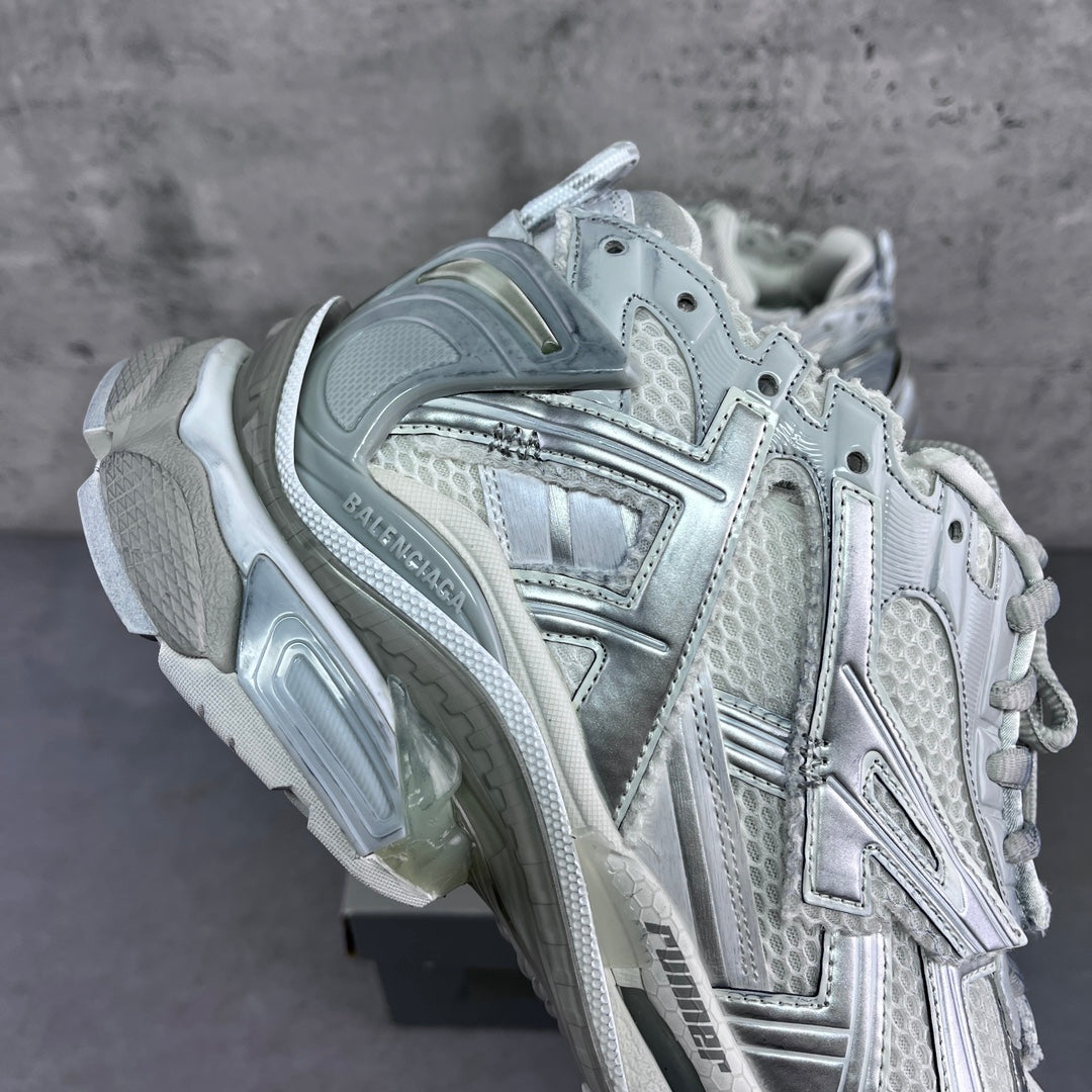 Balenciaga unisex sneakers close-up of laces, quarter panel, and cushioned heel.