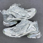 Balenciaga unisex sneakers in silver-gray with mesh panels and lace-up front.