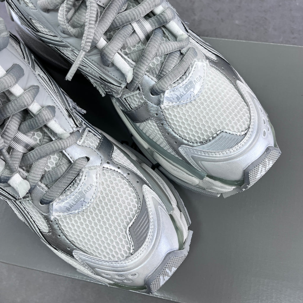 Balenciaga unisex sneakers close-up of knit upper, laces, and textured toe area.
