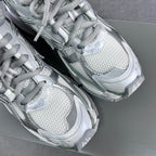 Balenciaga unisex sneakers close-up of knit upper, laces, and textured toe area.