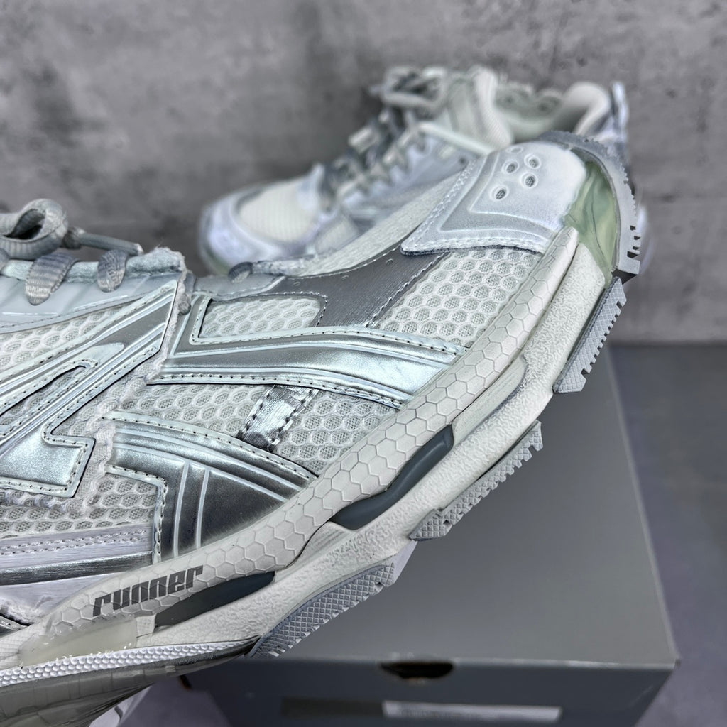 Balenciaga unisex sneaker close-up of textured side panels and lace-up.