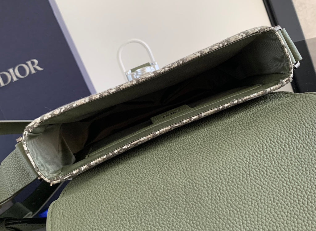 Open Dior monogram bag showing inner lining, olive pebbled leather exterior