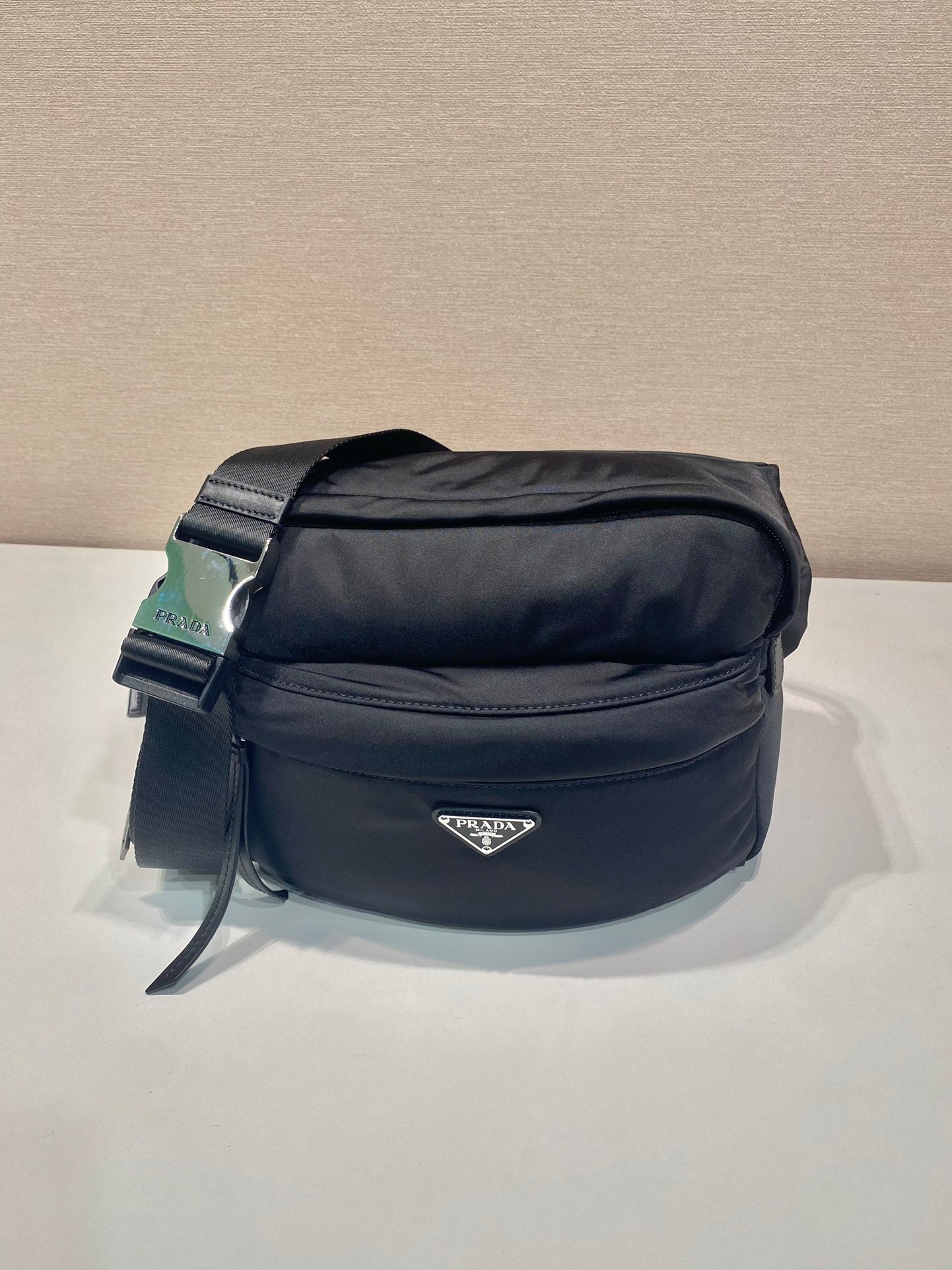Prada black nylon crossbody bag with top zip and adjustable shoulder strap