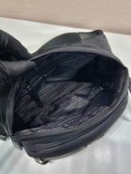 Prada black nylon bag interior view with zip pocket and textured lining