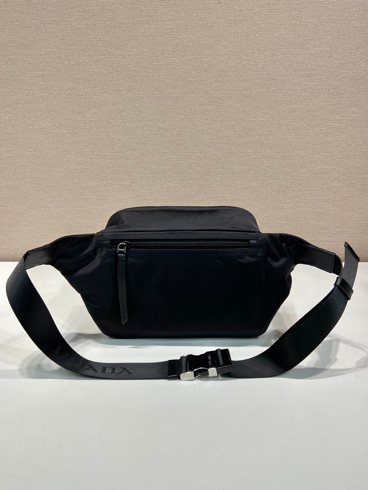 Prada black nylon waist bag with dual compartments and adjustable belt strap