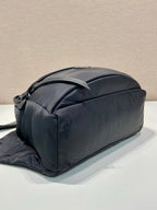 Prada black nylon toiletry bag with rounded top and side zipper pull