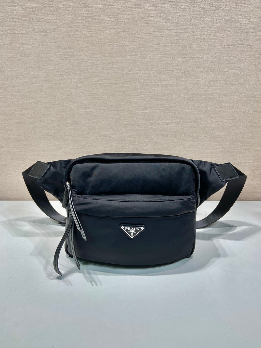 Prada black nylon belt bag with front zip pocket and adjustable strap