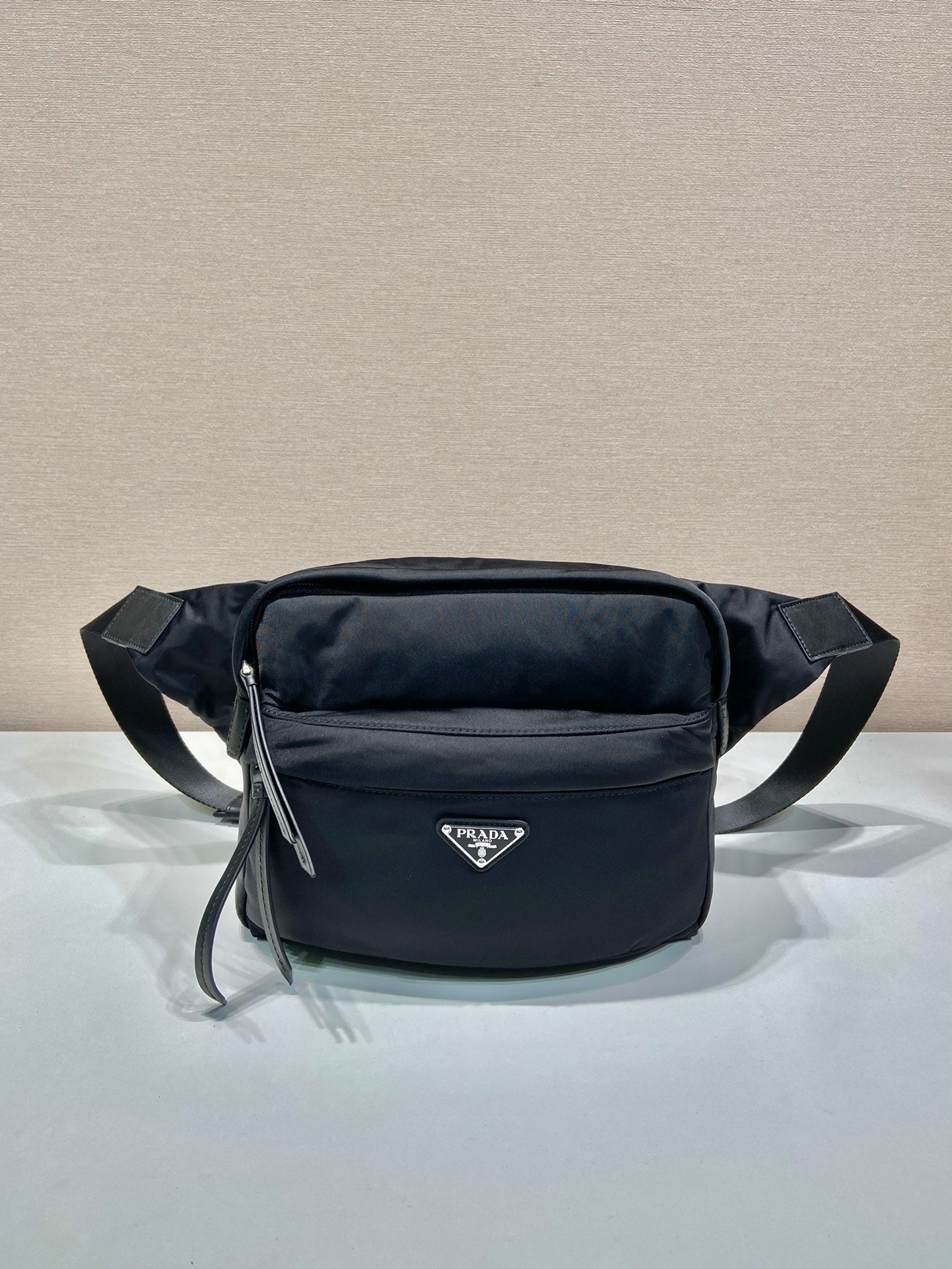 Prada black nylon belt bag with front zip pocket and adjustable strap