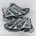 Chunky unisex sneakers with light gray mesh uppers, silver accents, and dark lace-up panels