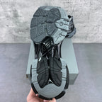 Sneaker outsole view with thick tread and molded rubber traction pattern