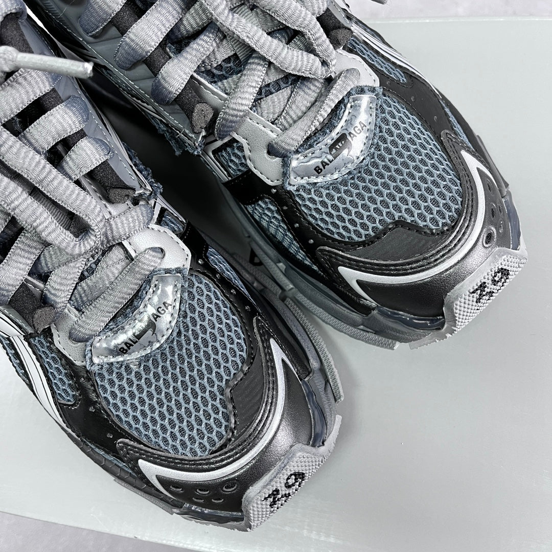 Pair of lace-up sneakers with blue-gray mesh and silver BALENCIAGA branding on the tongue
