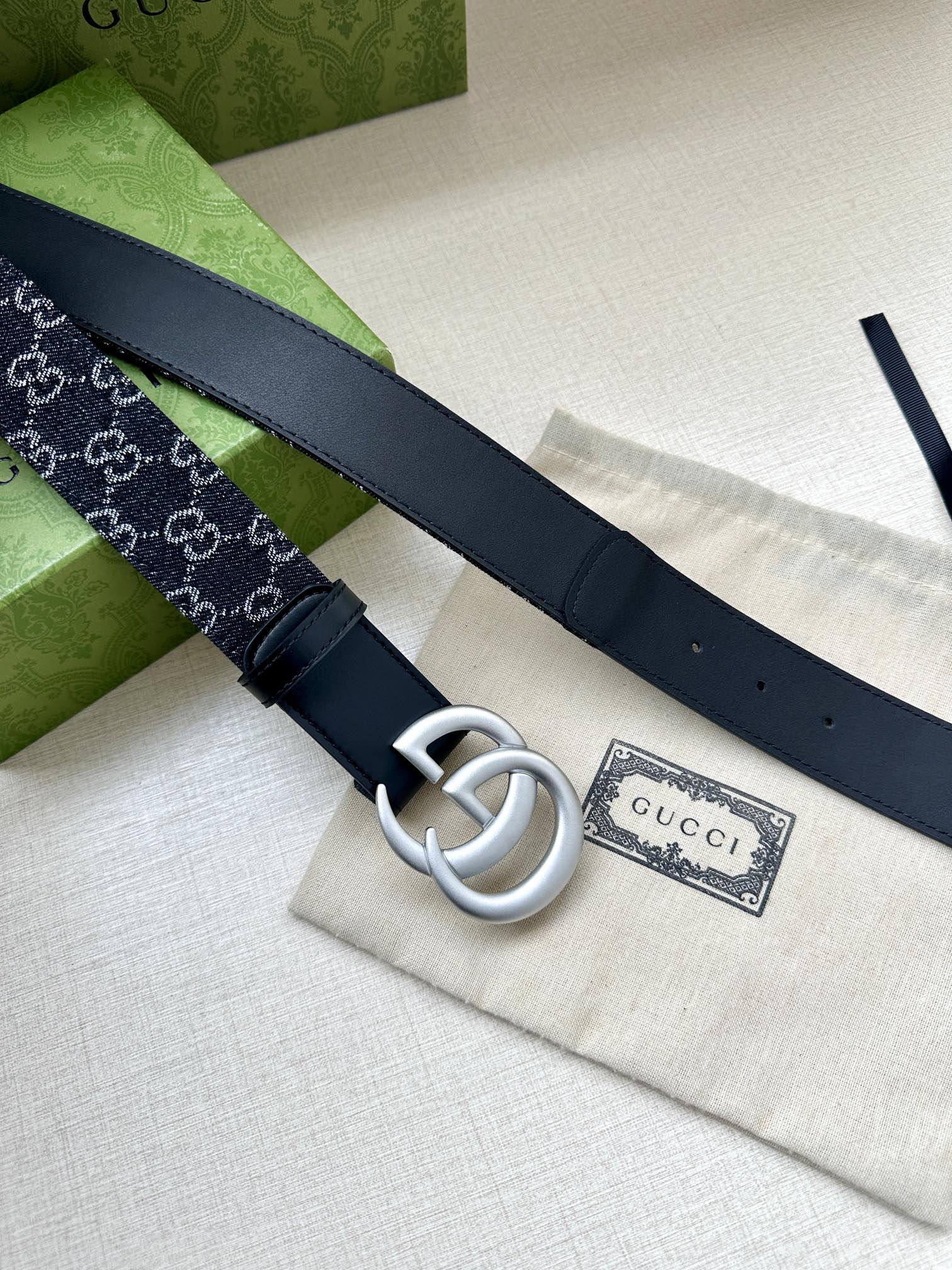 Gucci belt side view: silver double-G buckle on dark navy leather strap
