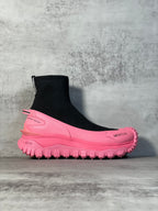 Moncler sock boot sneaker with black knit upper and pink lug sole, side logo.