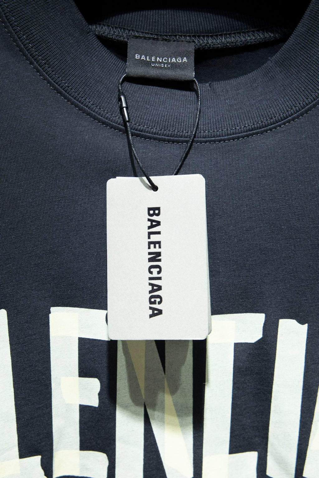 Balenciaga T-shirt neckline with tag at collar and embroidered logo detail