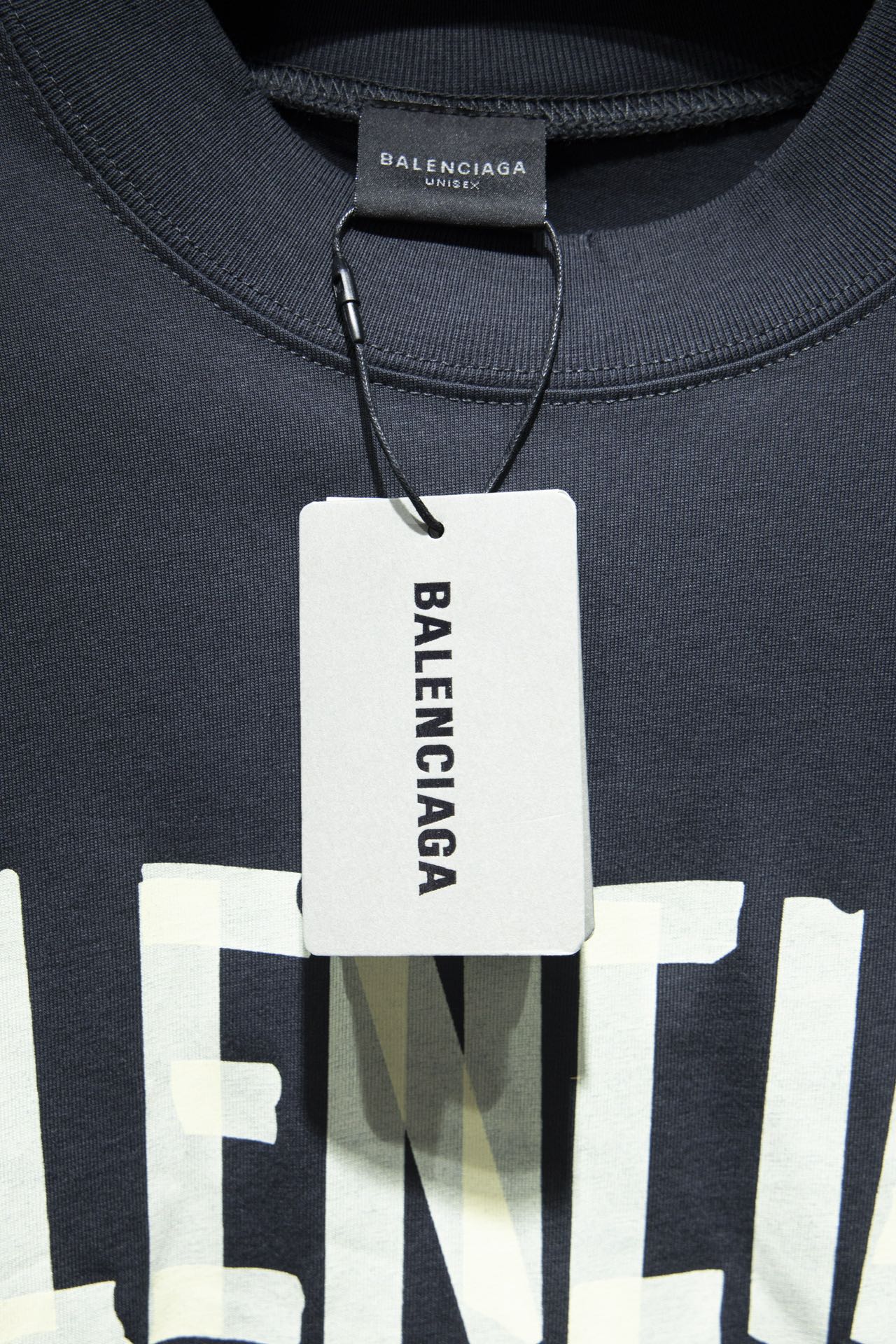 Balenciaga T-shirt neckline with tag at collar and embroidered logo detail