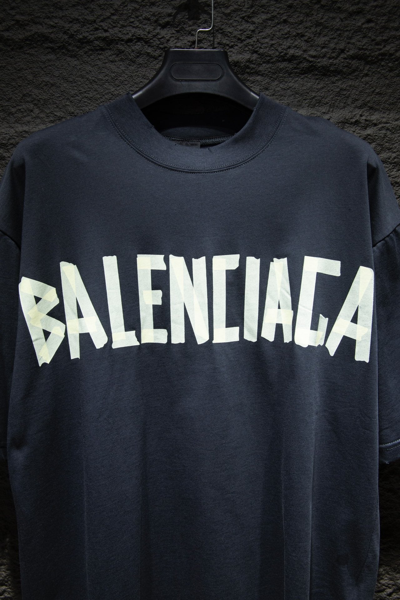 Balenciaga T-shirt in dark navy with large white BALENCIAGA logo across chest