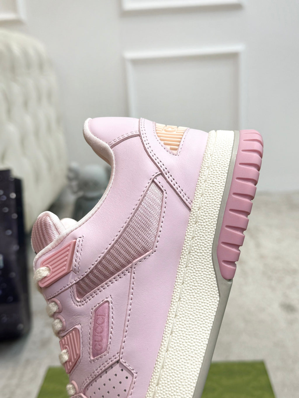 Pink platform lace-up sneakers with textured side panels and ribbed outsole