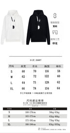 White and black pullover hoodies with front view and size chart diagram
