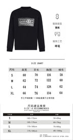 Black crewneck sweatshirt and size chart with measurements