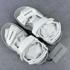 Balenciaga unisex white sandal pair on gray surface with crisscross laces