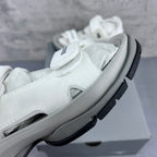 Balenciaga unisex white sandal close-up of upper strap and thick light-gray sole