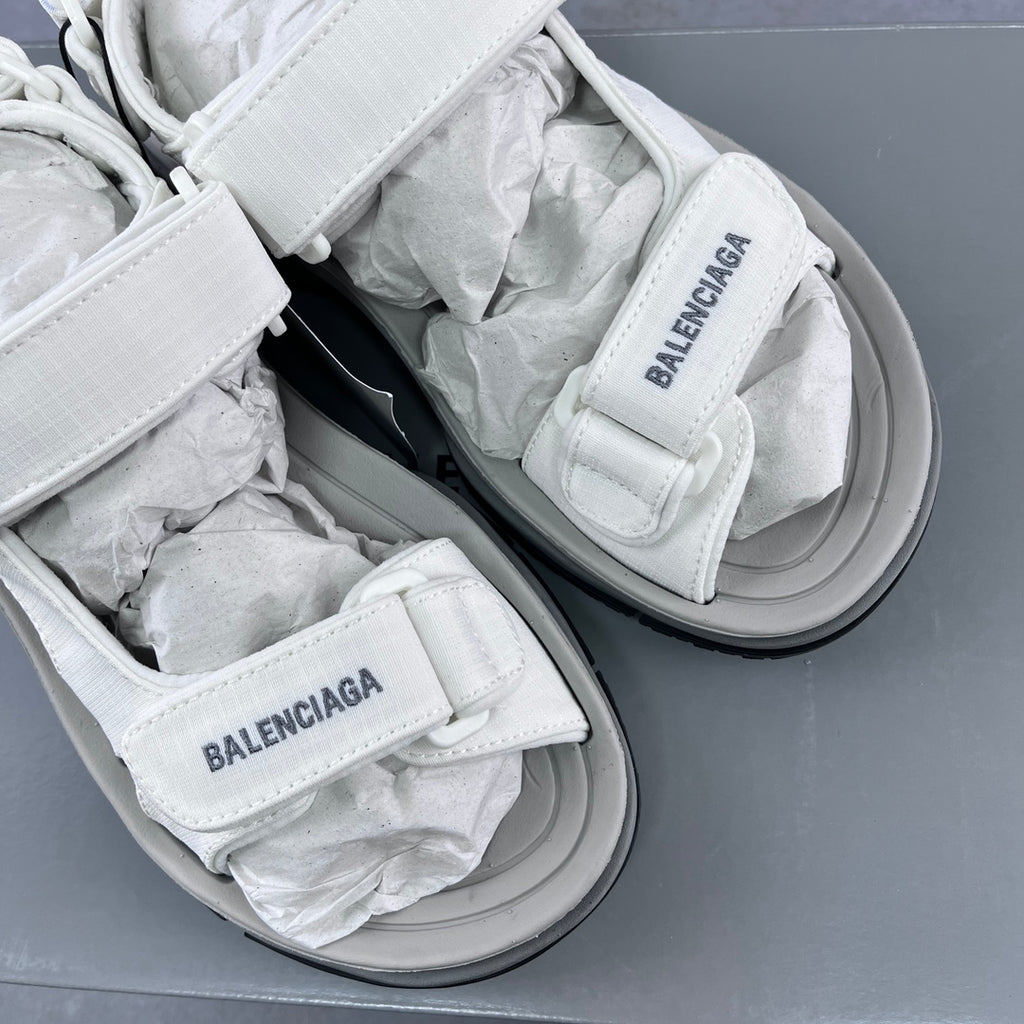 Balenciaga unisex white sandals showing two straps with printed logo and gray soles