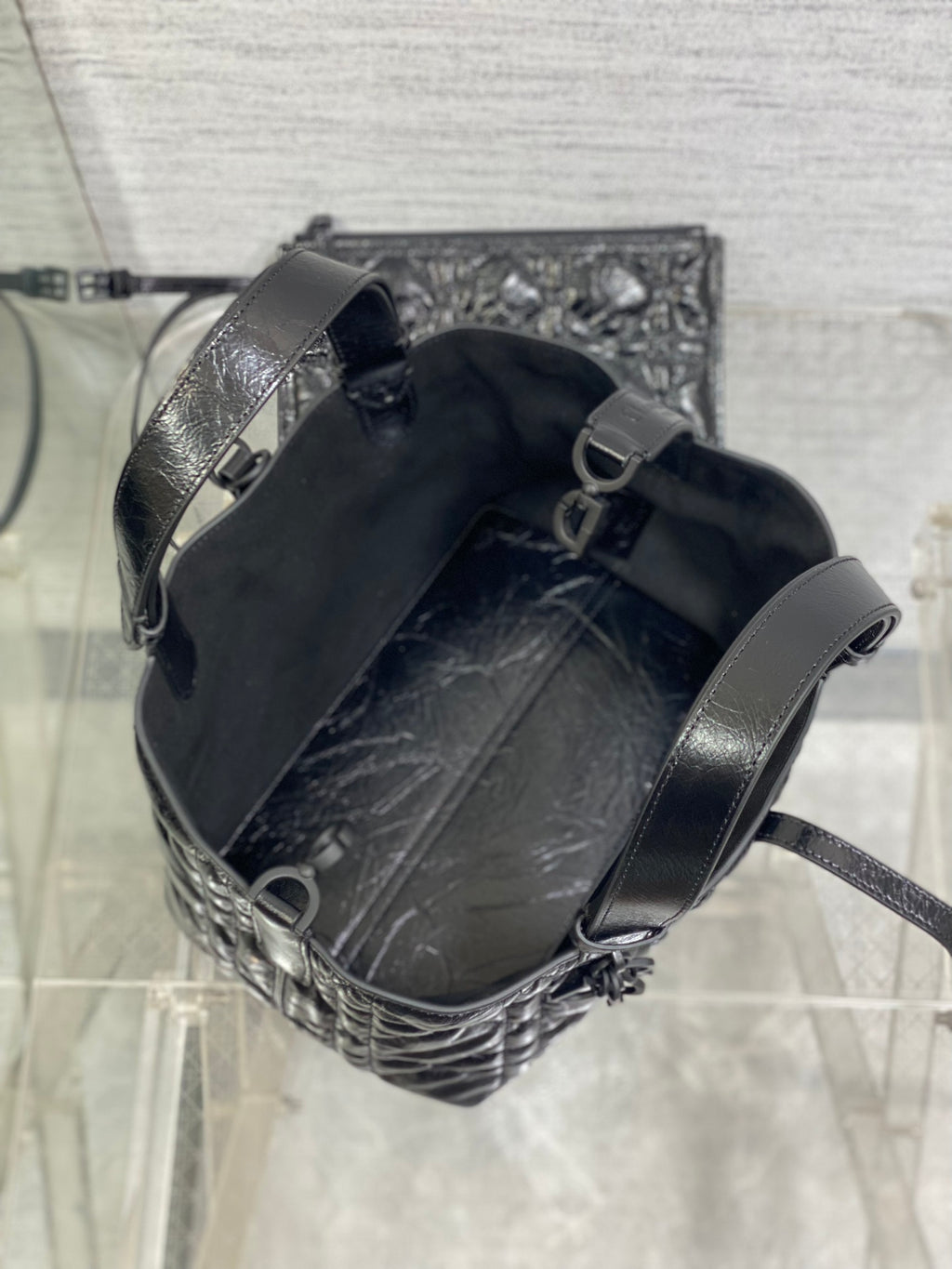 Dior mini bucket bag with drawstring opening, dark interior and leather trim