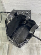 Dior mini bucket bag with drawstring opening, dark interior and leather trim