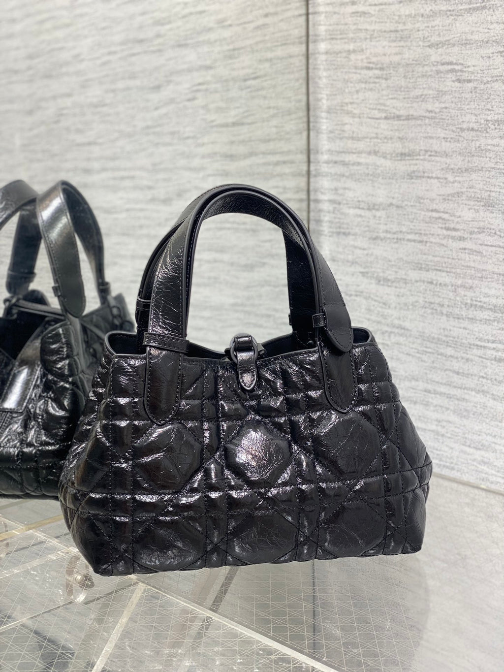 Dior small quilted handbag with front clasp, dark metallic leather top handle
