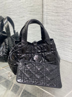 Dior quilted handbag with front pocket panel, dark metallic leather and top handles