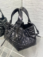 Dior quilted handbag with removable shoulder strap, dark metallic leather and clasp