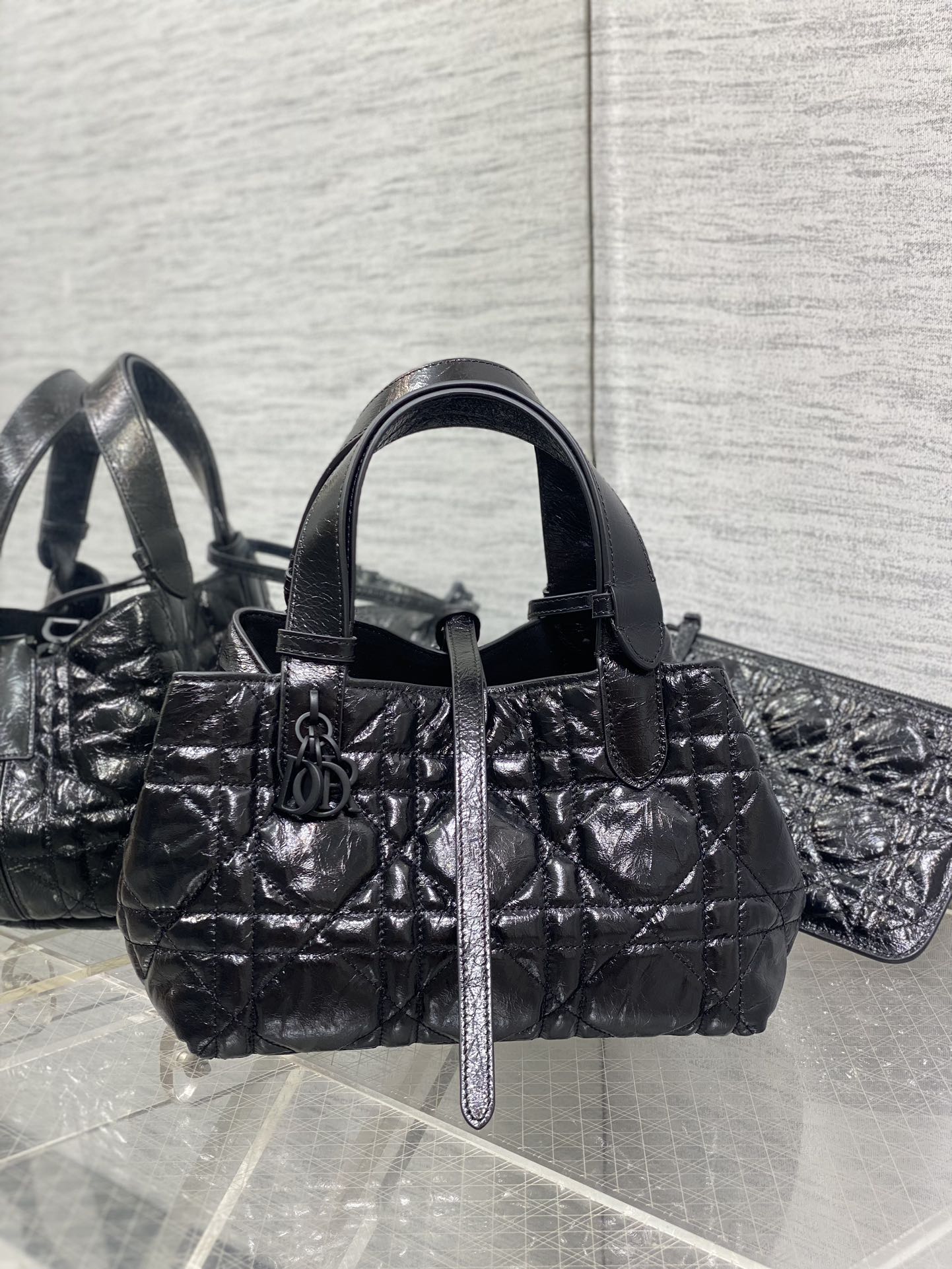 Dior quilted small tote bag in dark metallic leather, top handles and front clasp