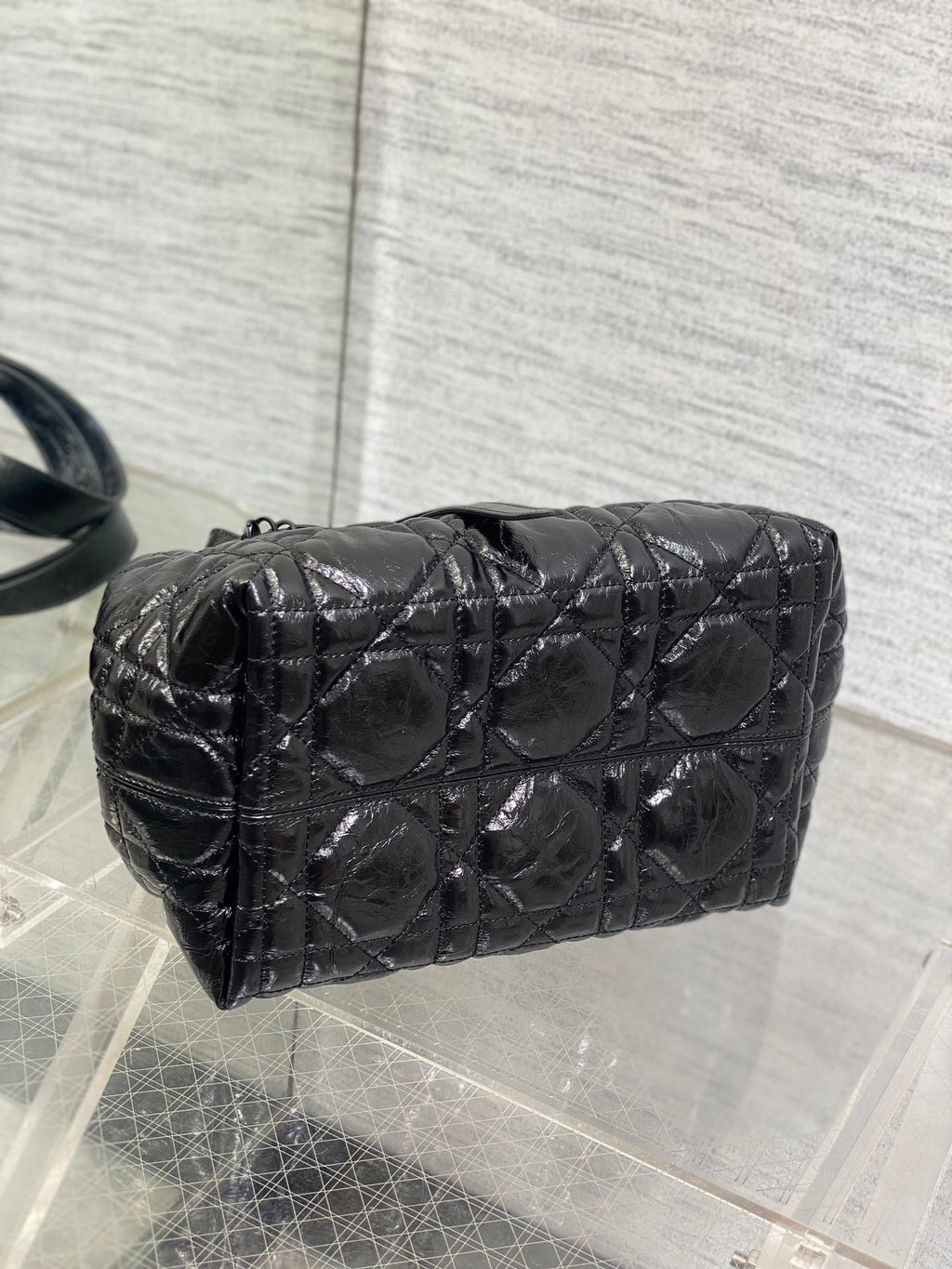 Dior quilted mini bucket bag in dark metallic leather, curved top and handles