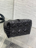 Dior quilted mini bucket bag in dark metallic leather, curved top and handles