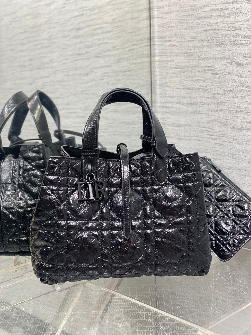 Dior tote bag with top handles, silver-tone hardware, quilted black exterior