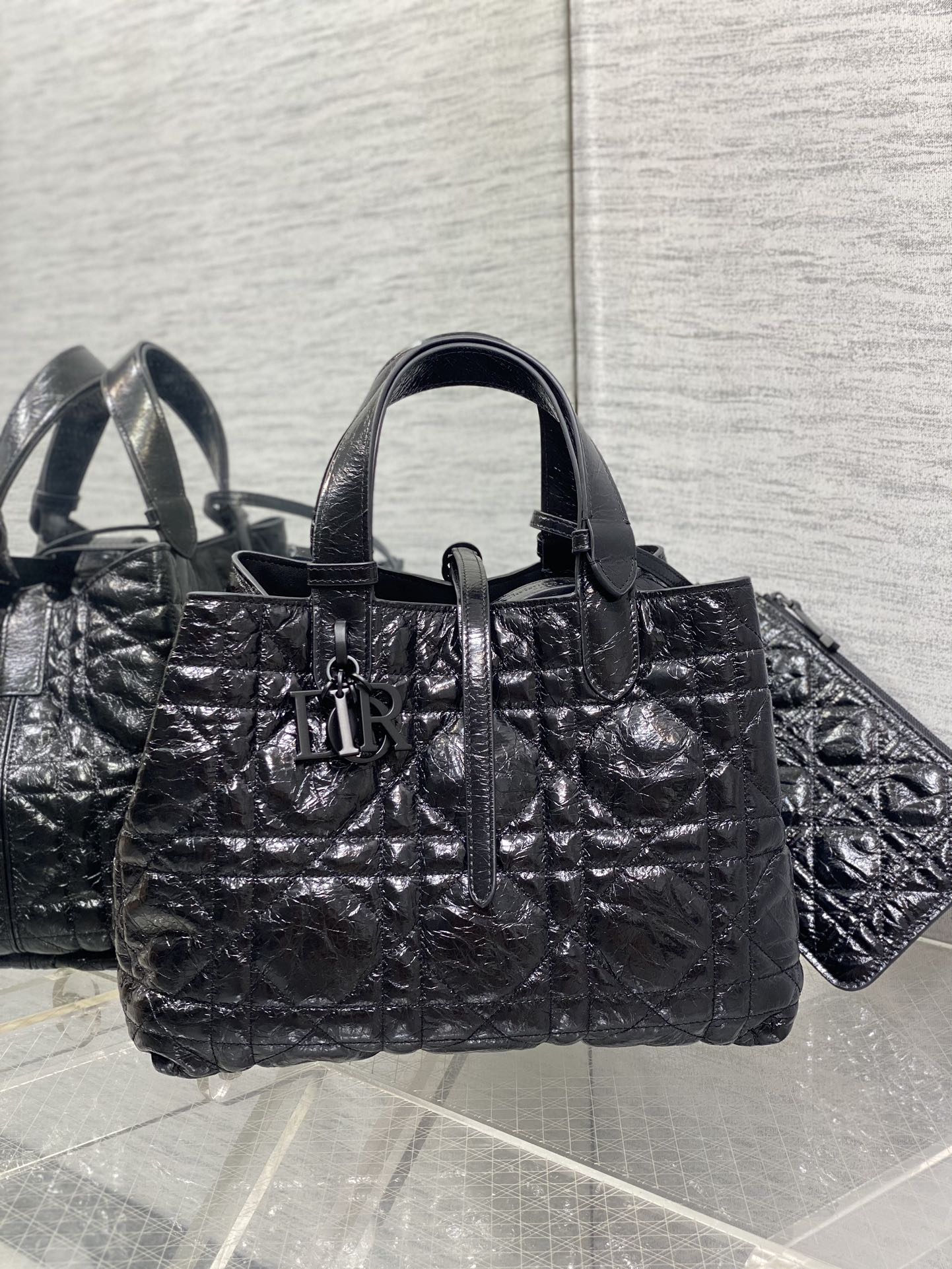 Dior tote bag with top handles, silver-tone hardware, quilted black exterior
