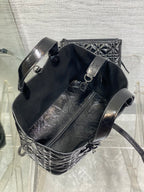 Dior bucket-style tote with adjustable shoulder strap, silver buckle hardware, black