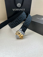 Versace belt: blue Greek-key strap and gold/silver Medusa head buckle, side view.