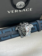 Versace belt close-up: blue patterned strap with silver Medusa buckle and holes.