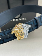 Dark blue patterned belt with Greca motif and ornate gold-silver Medusa buckle
