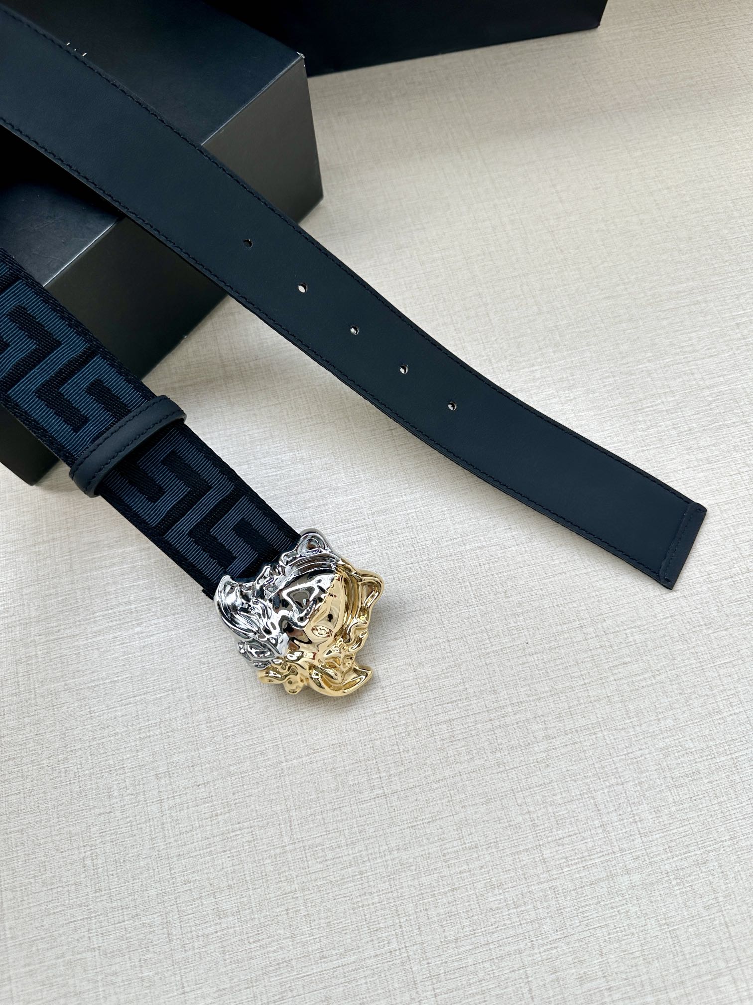 Dark blue leather belt strap with Greca panel and gold-silver Medusa buckle