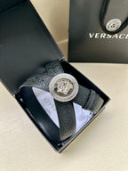 Versace belt in dark blue with embossed detailing and large silver Medusa buckle.