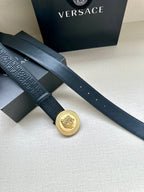 Versace belt in dark blue with gold Medusa medallion buckle on overlapping straps.