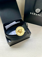 Versace belt in dark blue leather with gold Medusa medallion buckle.