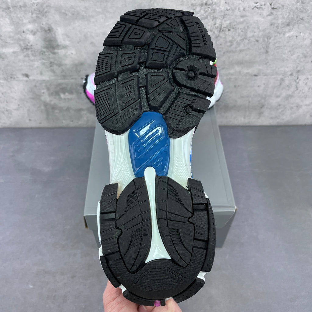 Balenciaga unisex sneaker outsole, textured black tread with purple accent near heel